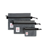 Topo Designs Accessory Bags- product shot of the medium, small, and micro accessory bags in charcoal gray.