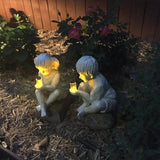 Children holding a can of fireflies - Garden Statue Decoration